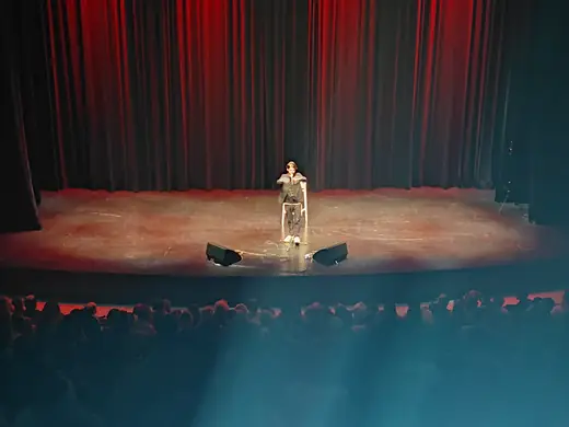 Dovi Neuburger on a theater stage
