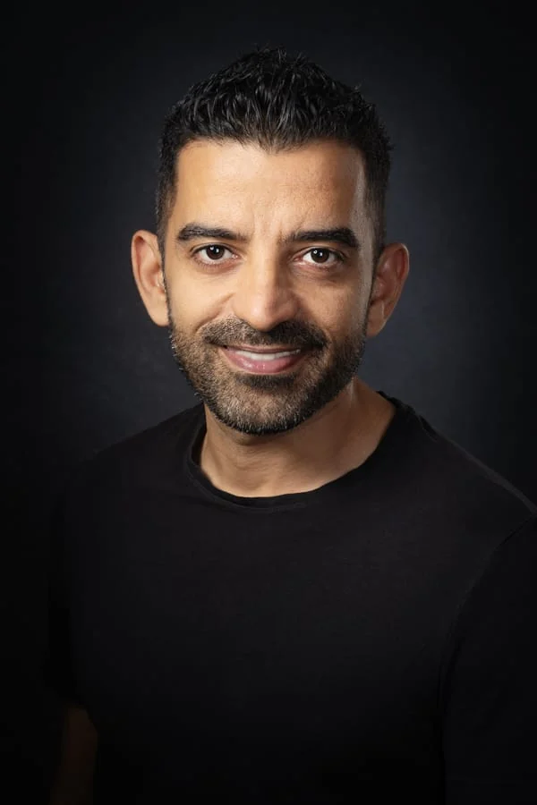 Ronen Tverya smiling in a black shirt