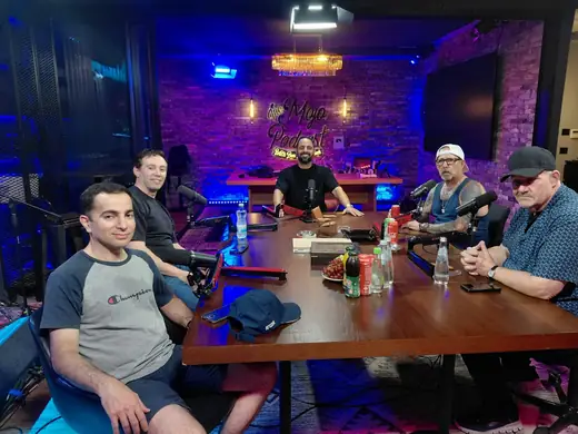Group recording around The Mojo podcast table