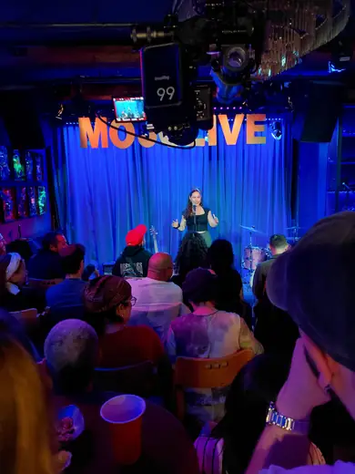 Comedian performing on the MOJO Live stage