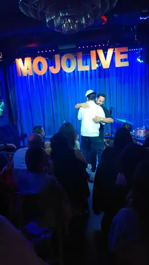 Audience watching a comedian at MOJO Live